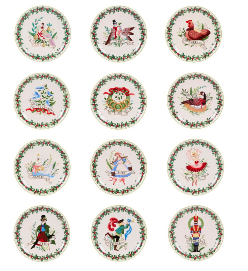 Set of twelve porcelain 12 Days of Christmas dinner plates presented in a premium keepsake gift box with festive holly border designs.