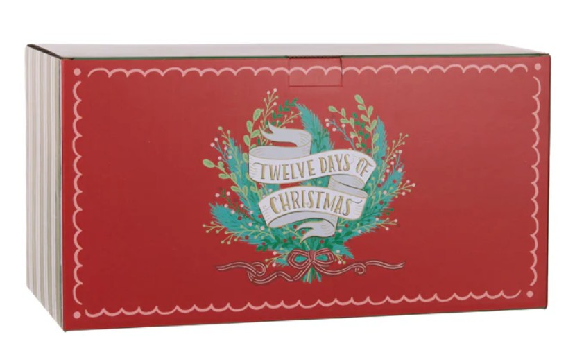 A red Christmas advent calendar box with a decorative wreath and banner reading 'Twelve Days of Christmas' on the front, shown on a plain white background.