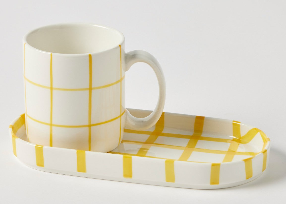 Cream ceramic mug and matching tray set with yellow check pattern, styled as a breakfast set from The Little Barn Tarago