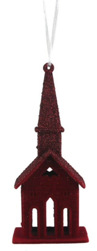 A red church-shaped Christmas ornament with a glittery spire and a white hanging string, shown against a plain white background.