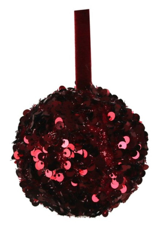 A round red sequin ball ornament with a matching red hanging ribbon, shown against a plain white background.