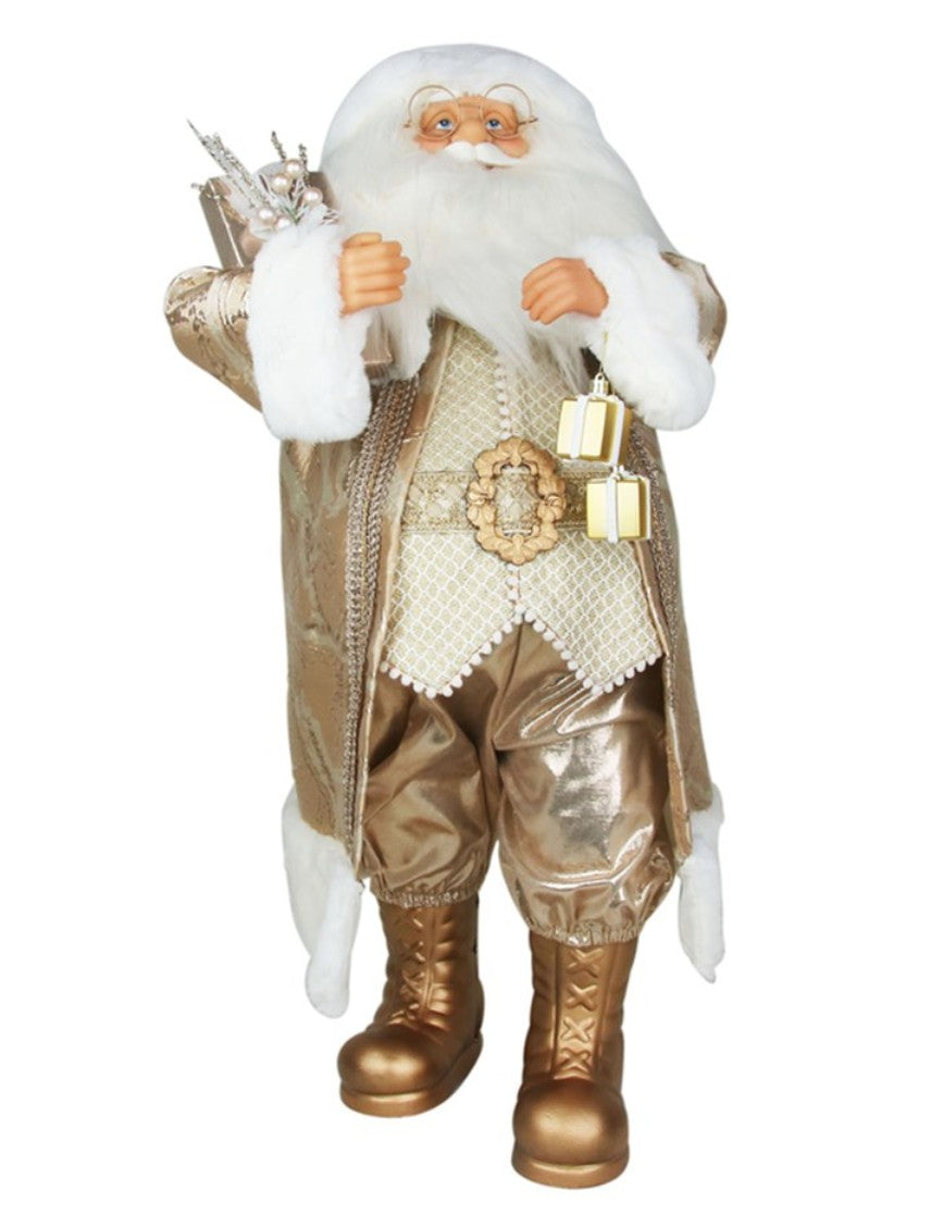 A Santa Claus figurine or decoration wearing a shiny metallic gold coat and pants with a white faux-fur collar and beard, holding a sack and gifts against a plain white background.