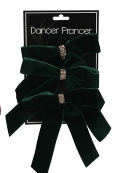 A set of three dark green velvet hair bows with rhinestone-embellished center bands, attached to a black card labeled 'Dancer Prancer' and photographed against a white background.