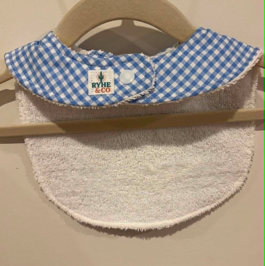 Back of baby bib- example, button and Ryhe & co tag