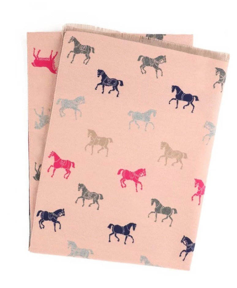 Two pink towels with horse pattern on a white background