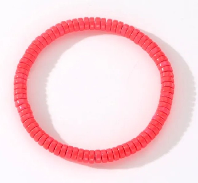 Coral heishi bead stretch stacker bracelet for everyday wear and layering with other colourful bracelets.