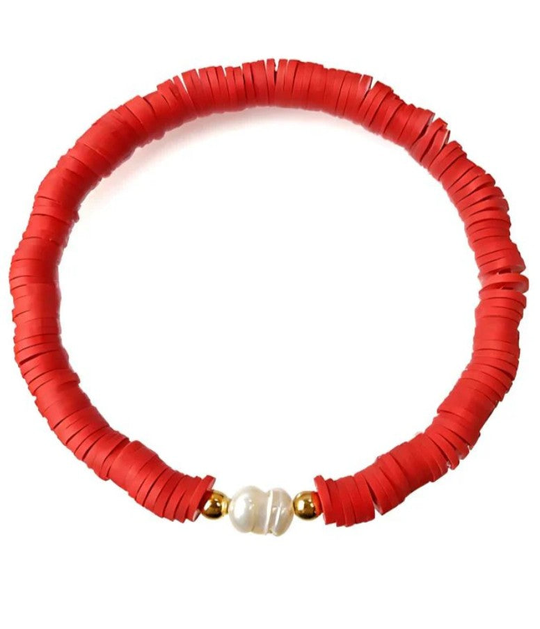 Cherry red heishi bead stretch bracelet featuring a freshwater pearl centrepiece with gold accent beads.