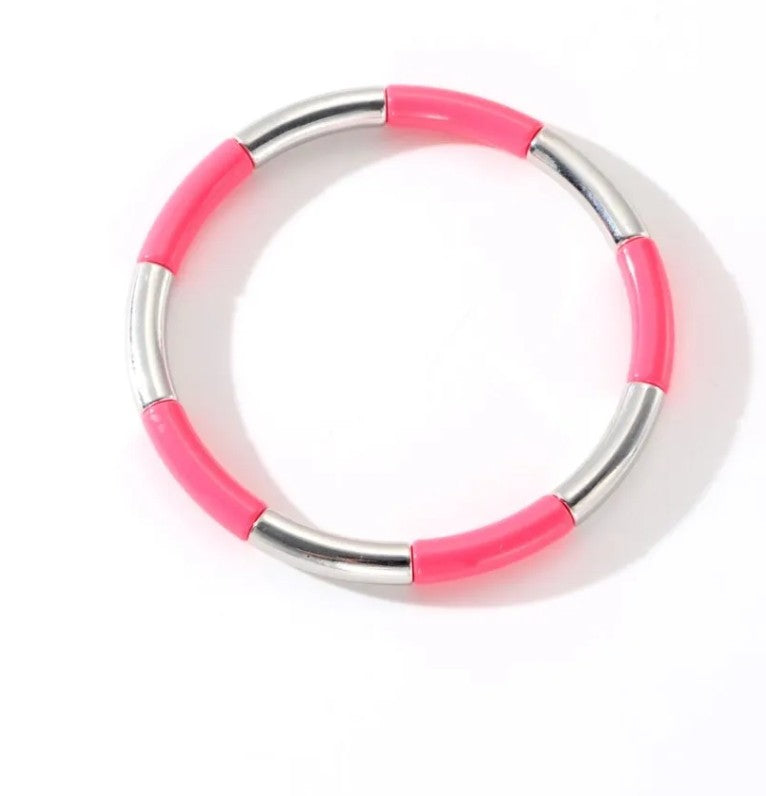 Coral pink and silver stretch bracelet featuring stainless steel tube beads, perfect for everyday wear and stacking.