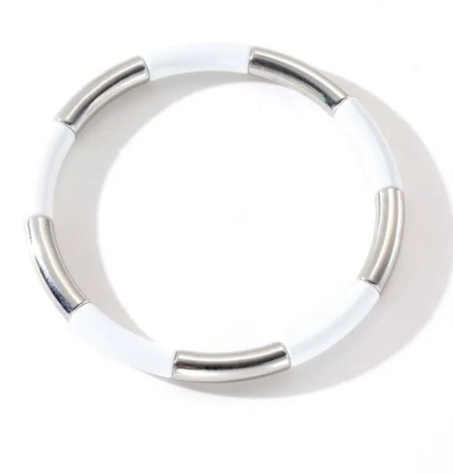 White stretch bracelet with polished stainless steel tube accents, perfect for everyday wear and layering.